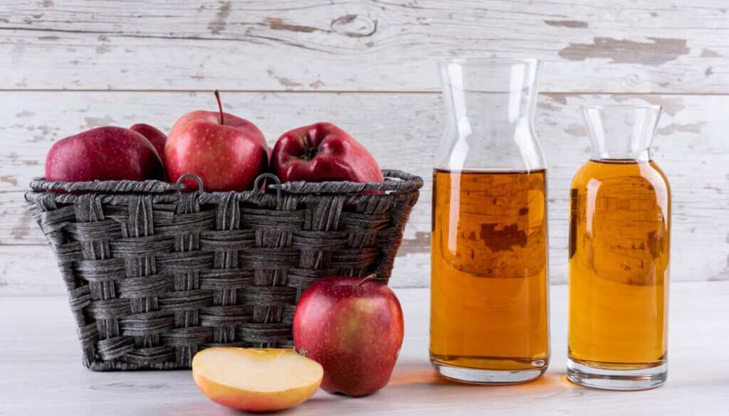 cinnamon sticks and apple cider vinegar bottle