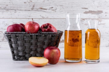 cinnamon sticks and apple cider vinegar bottle